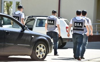 Percheziții la mai multe sedii …